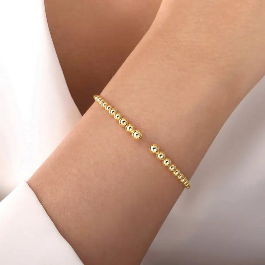 GABRIEL & CO YELLOW GOLD GRADUATED BEAD BUJUKAN OPEN BANGLE
