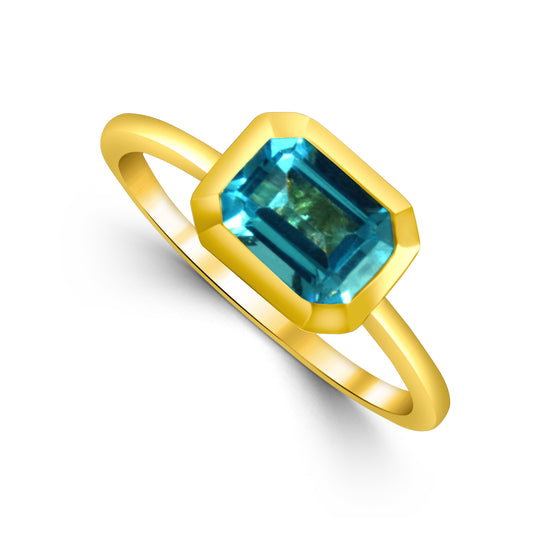 14K YELLOW GOLD EMERALD CUT BLUE TOPAZ BEZEL SET RING