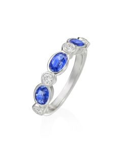 GUMUCHIAN WHITE GOLD ROUND DIAMOND AND OVAL SAPPHIRE RING